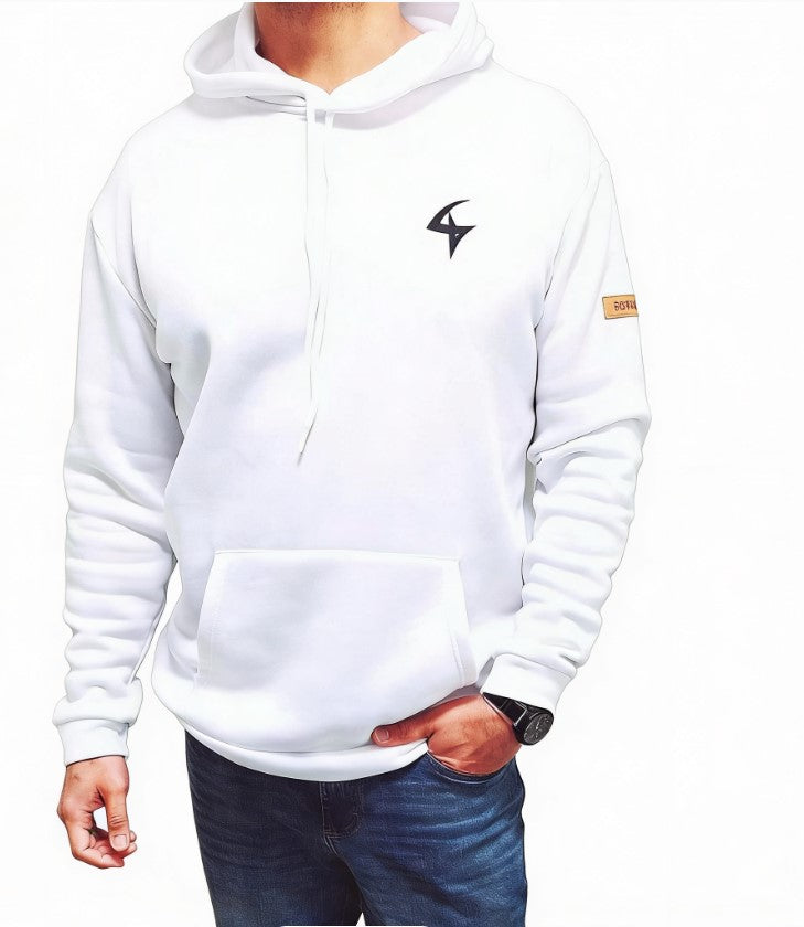 A white pullover hoodie with a black stylized logo on the left chest and a small tan patch on the right sleeve, worn by a model in blue jeans against a white background.